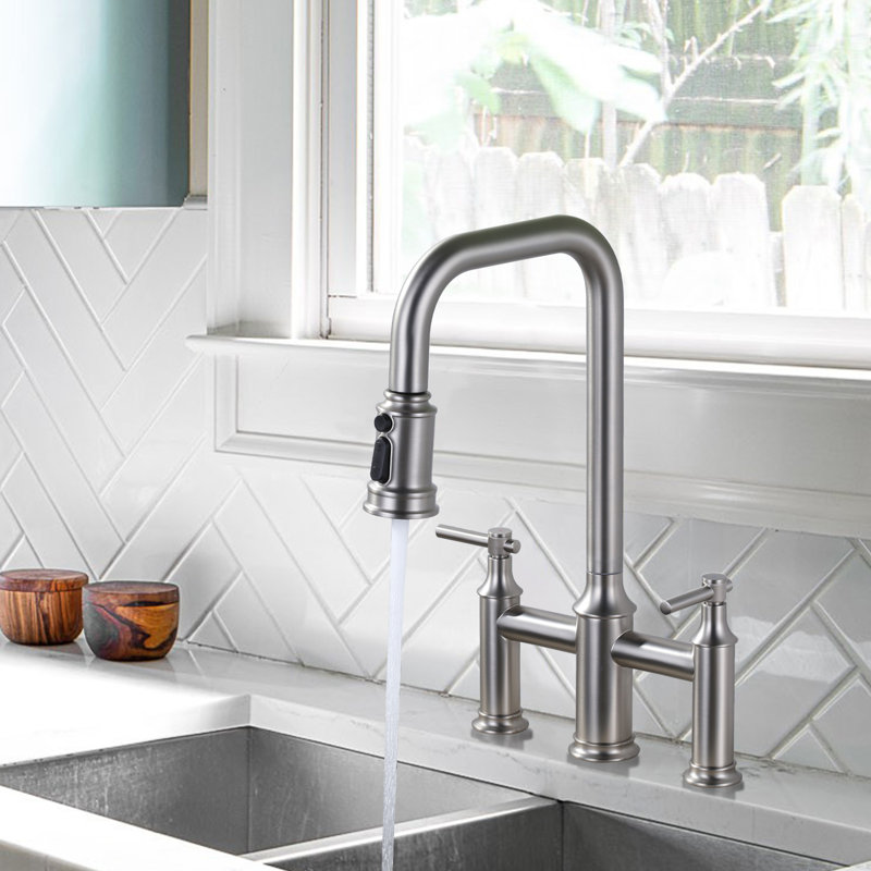 Bridge-Style Kitchen Faucet With Dual Handles And A Pull-Down Spray Head, Designed For Installation On A 3-Hole Kitchen Sink