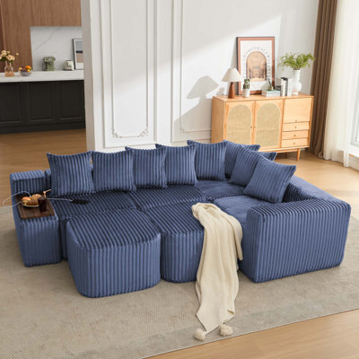 Canapé modulaire en forme de U désossé avec charge USB et sans fil, table basse mobile, porte-gobelets et conception sans assemblage pour des espaces de vie flexibles.