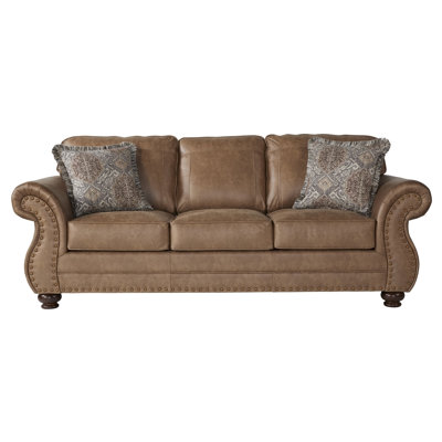 Le canapé en similicuir Leinster avec têtes de clou bronze antique, un ajout élégant et confortable à votre espace de vie