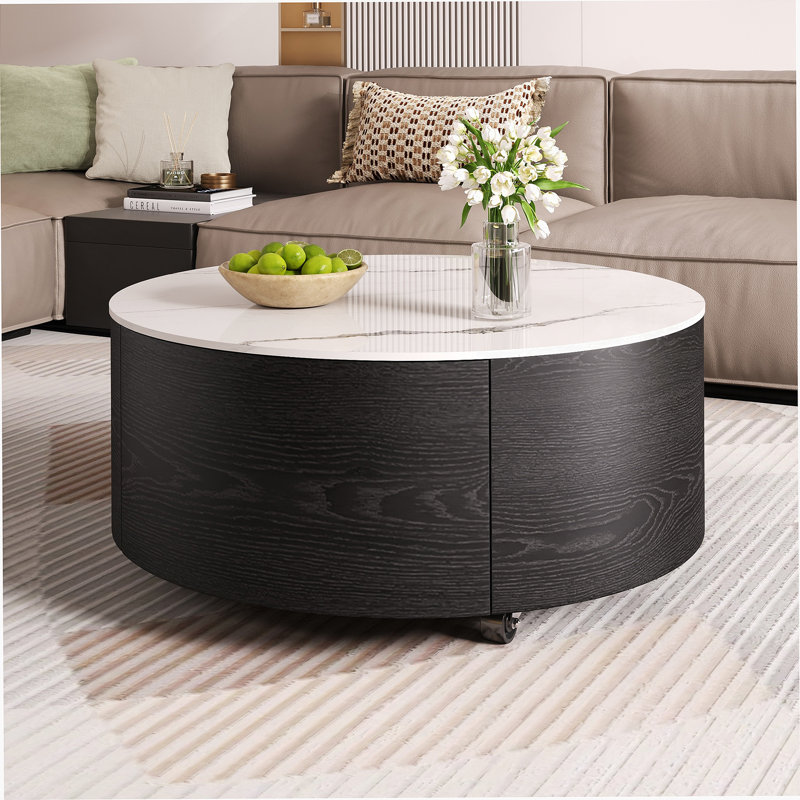 Table basse ronde moderne et fonctionnelle avec mobilité, tiroirs de rangement et plateau en pierre frittée durable pour des espaces de vie polyvalents
