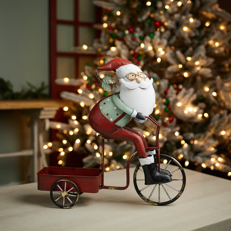 Père Noël fantaisiste faisant du vélo