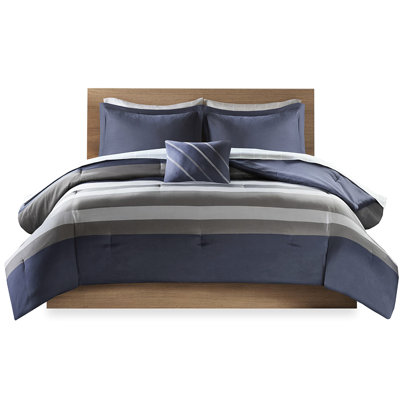 L'édredon et le drap à rayures doubles, de couleur bleu-gris, comprennent l'édredon, les taies décoratives, les taies décoratives, les draps-housses et les draps plats, les taies d'oreiller et la literie