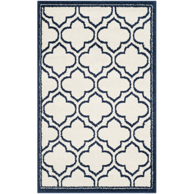 Ammundsen Geometric Area Rug in Ivory/Navy