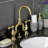 Kingston Brass English Country Two-Handle 3-Hole Deck Mount Bridge Bathroom Faucet with Brass Pop-Up-70187465