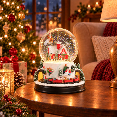 Boule à neige musicale de Noël avec traîneau du Père Noël et train en mouvement, boule à eau musicale lumineuse avec neige artificielle, décor de village d'hiver, cadeau de Noël pour toute la famille, ornement de table pour les fêtes