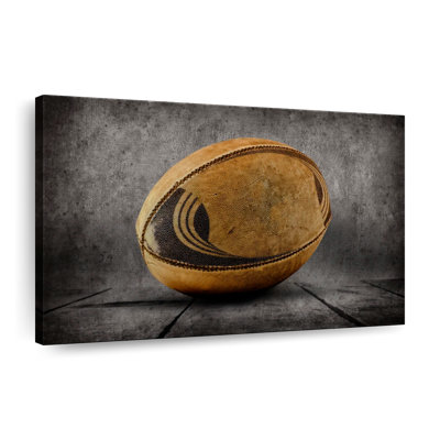 Vieux ballon de rugby sur toile