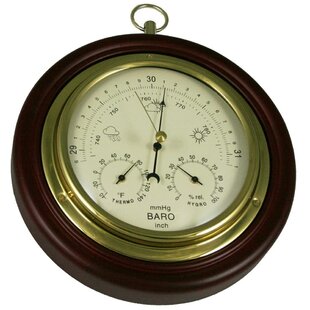 Baro-Hygro-Thermometer  A stainless steel and wooden desk