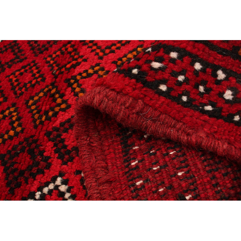 Tapis rouge en laine noué à la main