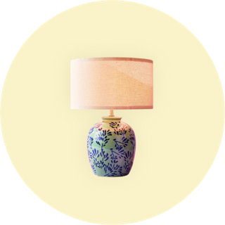 Ceramic table lamp with blue floral pattern and beige shade
