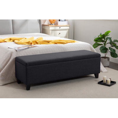 Banc de rangement en tissu Charice avec pieds en bois