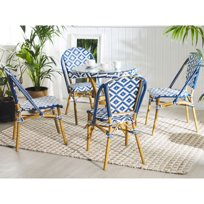 Gesine 4 - Person Patio Dining Set Round Table with Cushions Included