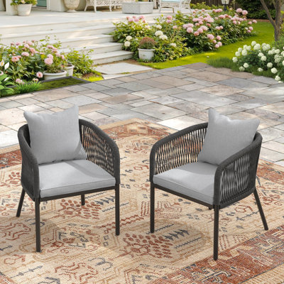 Fauteuil de salle à manger de patio moderne en résine tressée PE avec coussins