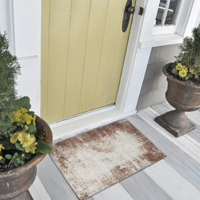 Tapis abstrait brun tissé à la machine