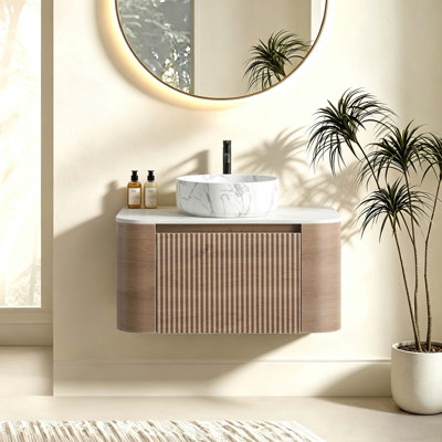 Meuble-lavabo courbé avec rangement à fermeture en douceur et porte-serviettes intégré