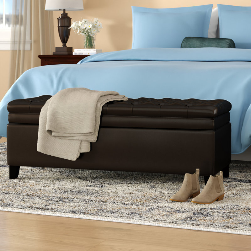 19.75'' Wide Tufted Rectangle Storage Ottoman Padded, button-tufted top stained legs Doubles as extra seating