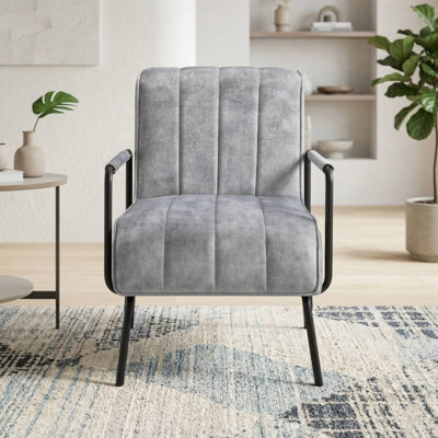 Fauteuil capitonné Monika