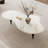 55“ Modern Glossy Sintered Stone Coffee Table with 3 Carbon Wood Legs, White Living Room Table