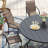 8-Person Round Patio Dining Set with 60" Dining Table and 8 Stackable PVC-coated polyester Chairs-762524937