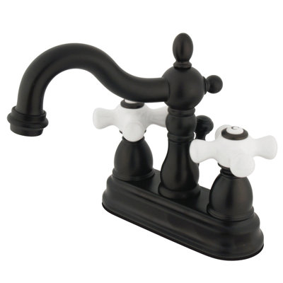Kingston Brass Heritage Two-Handle 3-Hole Deck Mount 4" Centerset Bathroom Faucet with Plastic Pop-Up