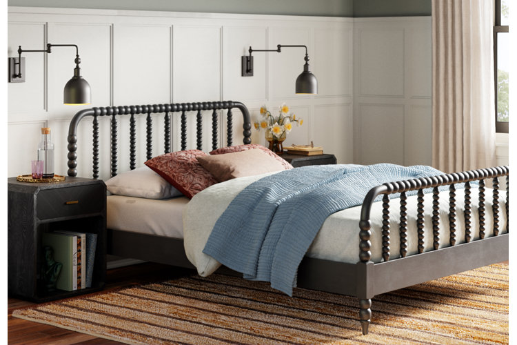 traditional farmhouse bedroom with a queen size spindle bed frame
