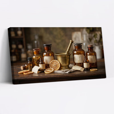 Bouteilles ambrées vintage et mortier en laiton sur une table en bois - Tableau sur toile