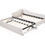 Lit de jour simple en L rembourré beige avec lit gigogne escamotable, idéal pour les dortoirs pour étudiants dans un très grand lit extensible