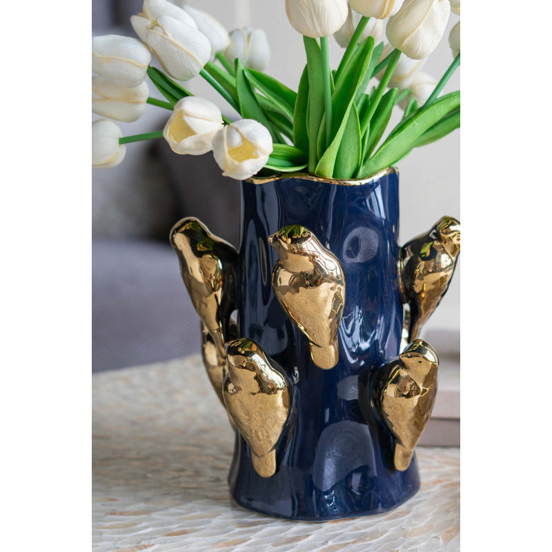 Vase en céramique avec branches d'oiseaux