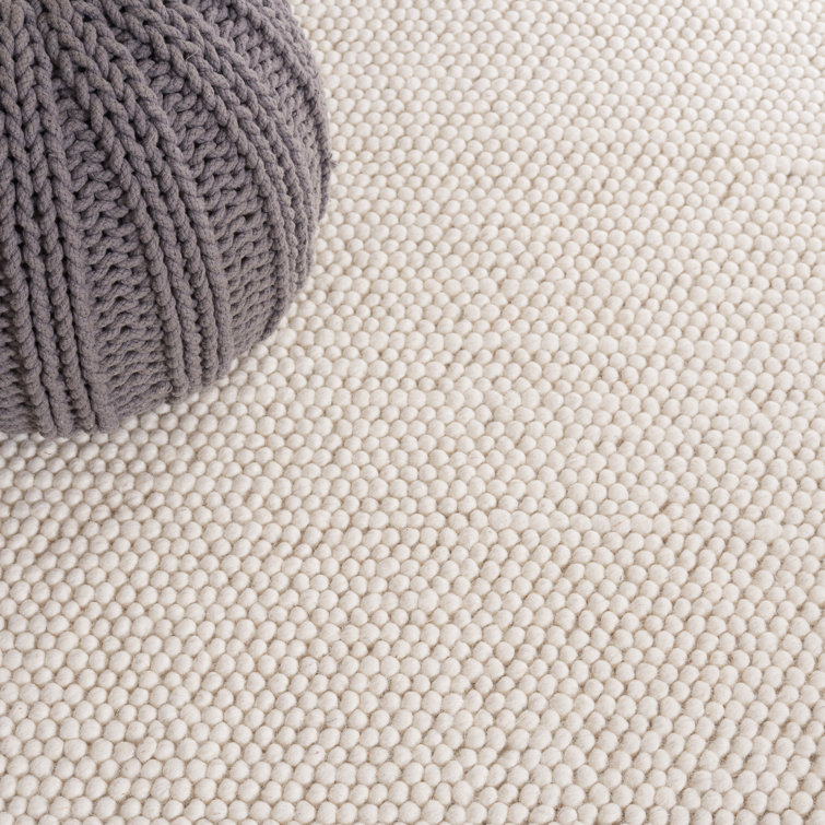 Charvik Solid Color Handmade Area Rug in Ivory