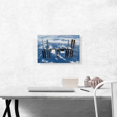 " International Space Sation Above A Blue Earth "