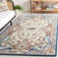 Tapis floral en laine / coton touffeté Cliatt bleu / ivoire-1595498884