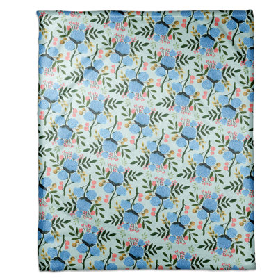Jeté polaire bleu à motif floral