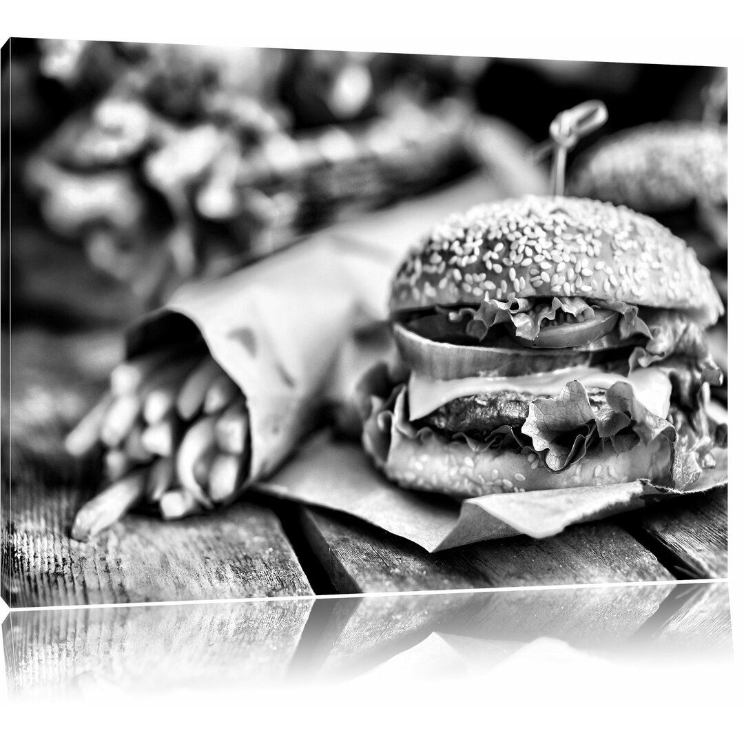 Leinwandbild Leckerer Burger und Pommes in Monochrom