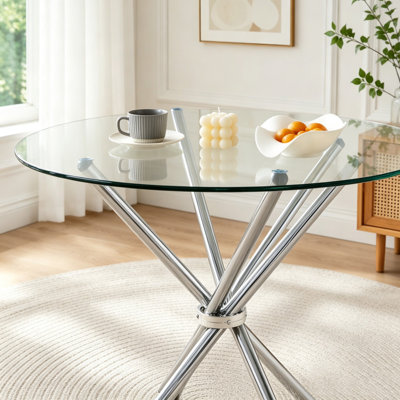 Table de salle à manger ronde en verre avec pieds en forme d'anneau