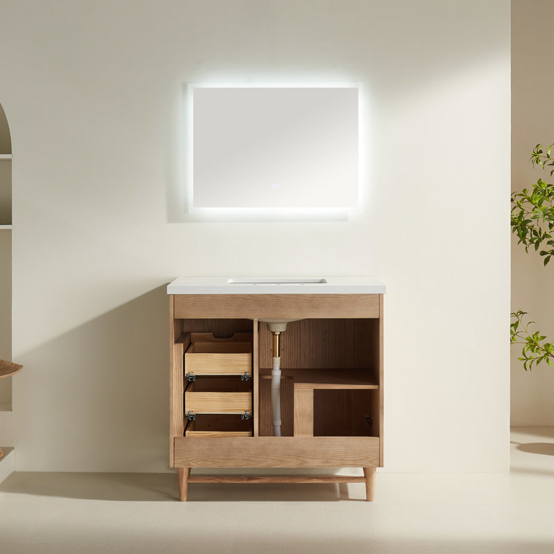 Meuble-lavabo sur pied de 91 cm (36 po) avec lavabo simple, structure en bois massif, comptoir blanc composite, armoire assemblée en usine, dosseret de comptoir, vasque carrée et quincaillerie à fermeture amortie.