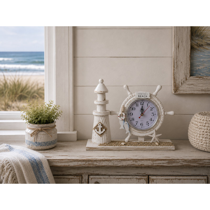 Horloge de table avec phare avec ancre et sable