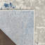 Tapis bleu et gris à tissage mécanique abstrait 7 pi x 10 pi
