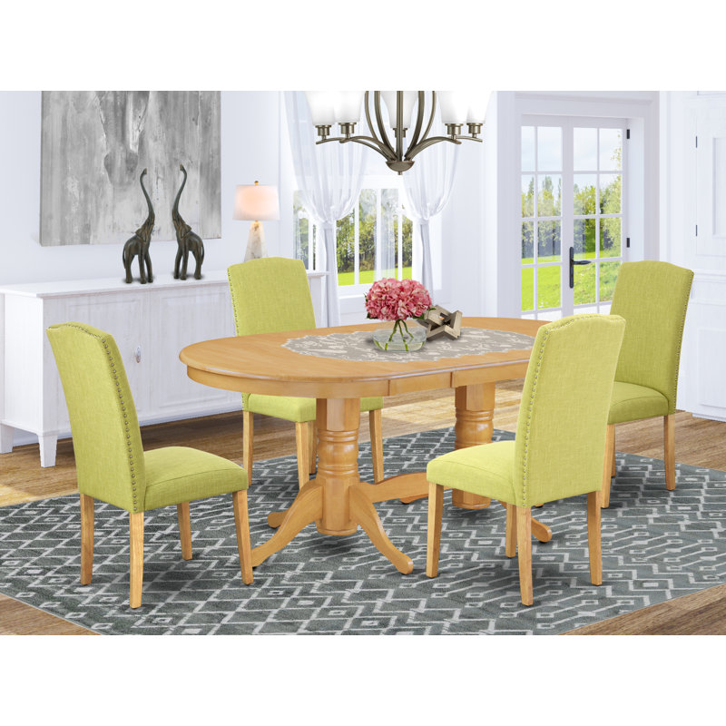 L'ensemble de mobilier de salle à manger 5 pièces comprend une table ovale en bois avec feuille papillon et 4 chaises Parsons en tissu Limelight, finition chêne