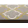 Tapis gris / jaune à motif géométrique