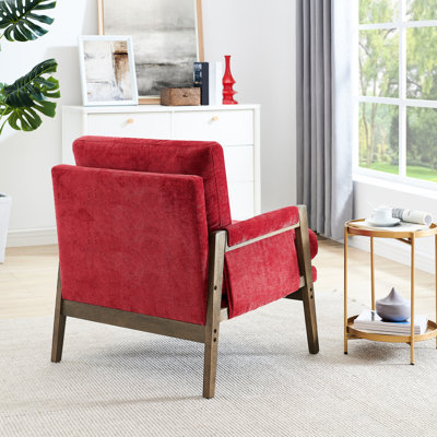 Fauteuil Jannie de style Mid-Century rouge avec structure en bois d'hévéa massif, modèle luxueux recouvert de velours, structure, rembourrage douillet