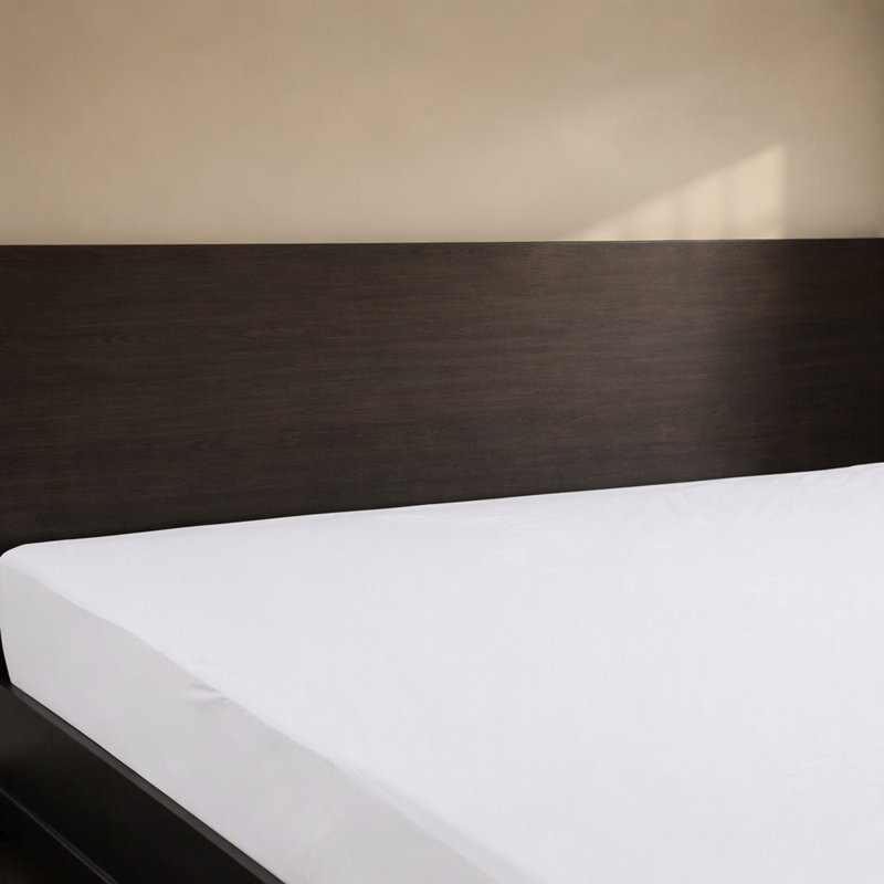 Protège-matelas hypoallergénique en tissu éponge bouclé avec barrière hydrofuge