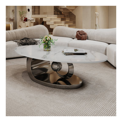 Table basse en marbre avec base sculpturale en acier inoxydable