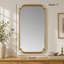 Miroir mural doré