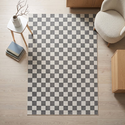 Tapis géométrique à carreaux crème et anthracite (2,6 pi x 4,9 pi)