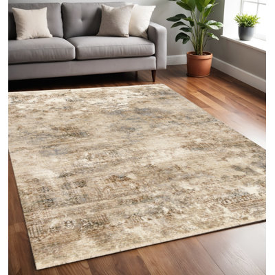 5' X 8' Cream Gray And Tan Abstract Area Rug