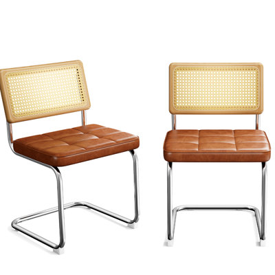 Deux chaises de salle à manger en bois naturel et massif, de style Mid-Century, revêtues de similicuir brun, structure en acier tubulaire, respirantes et confortables pour la cuisine, le salon, l'esthétique moderne, dossier, filet