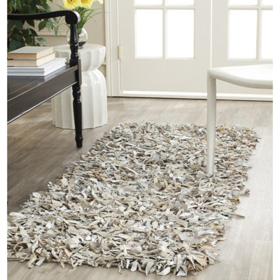 Tapis en cuir tissé à la main de couleur unie Godsey