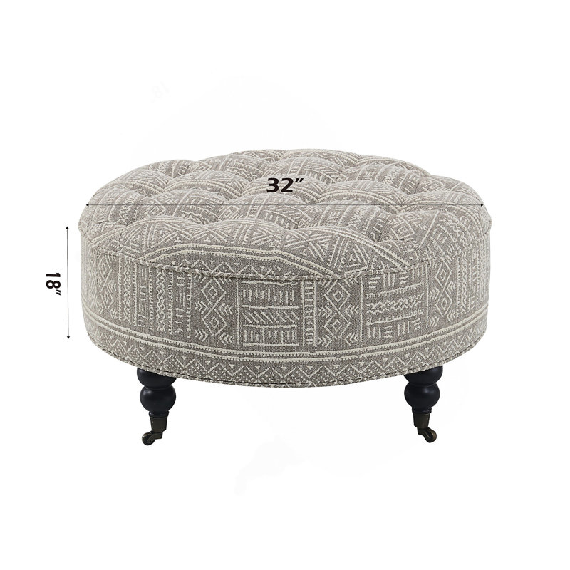 Repose-pieds Upendo avec roulettes, tissu à motifs pour une utilisation polyvalente et une mobilité accrue, parfait pour tout décor de pièce.