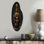 Chic bouteille de parfum noire et dorée - décoration murale incurvée en métal, sculpture murale asymétrique en métal