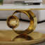 Table basse en marbre avec base sculpturale en acier inoxydable seulement la table, sans chaises.-652184828
