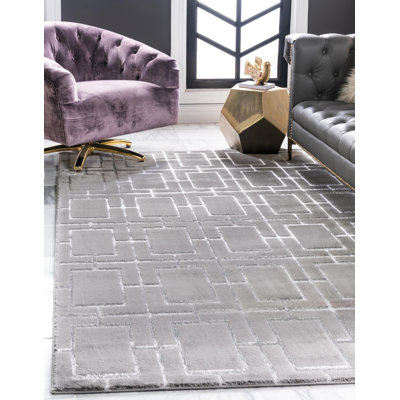 Tapis gris argenté à motif géométrique glam